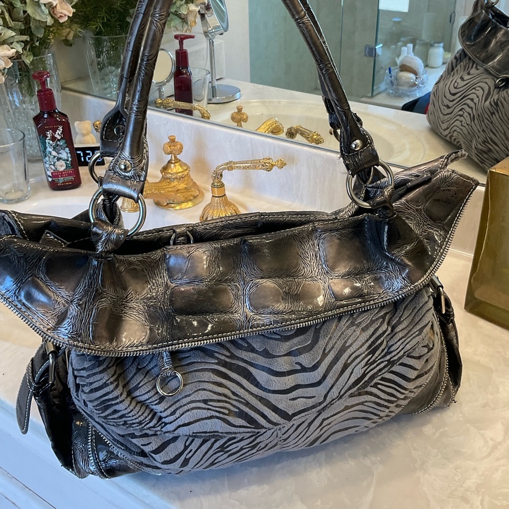 FREE with purchase of any other item at list price: Purse, black and grey strip